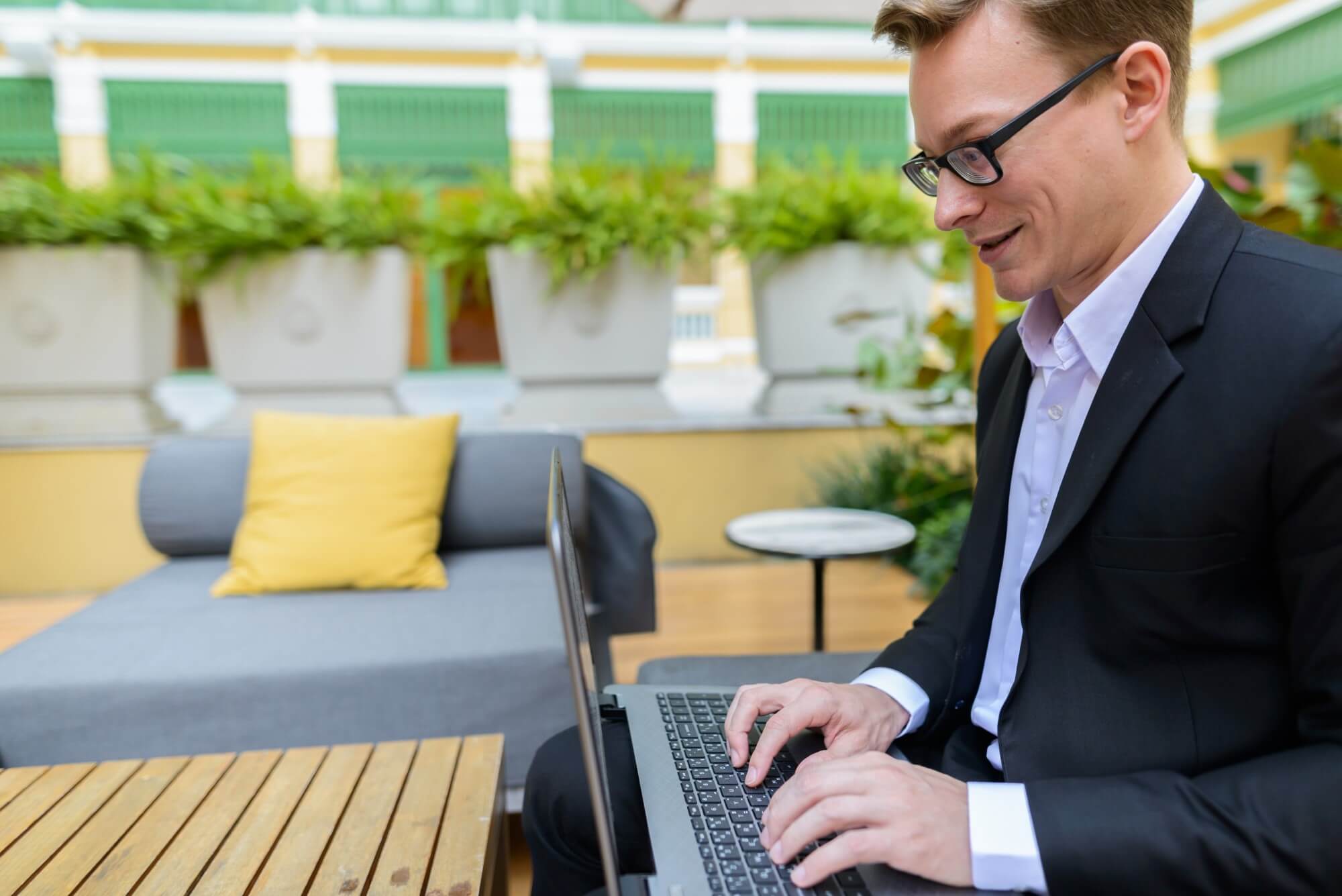 side-view-of-young-happy-caucasian-businessman